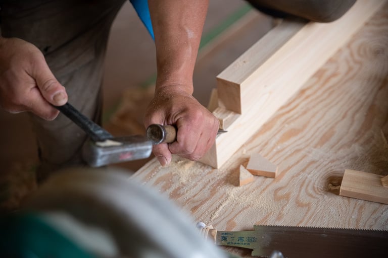 Craftsman working with chisel on woodworking project