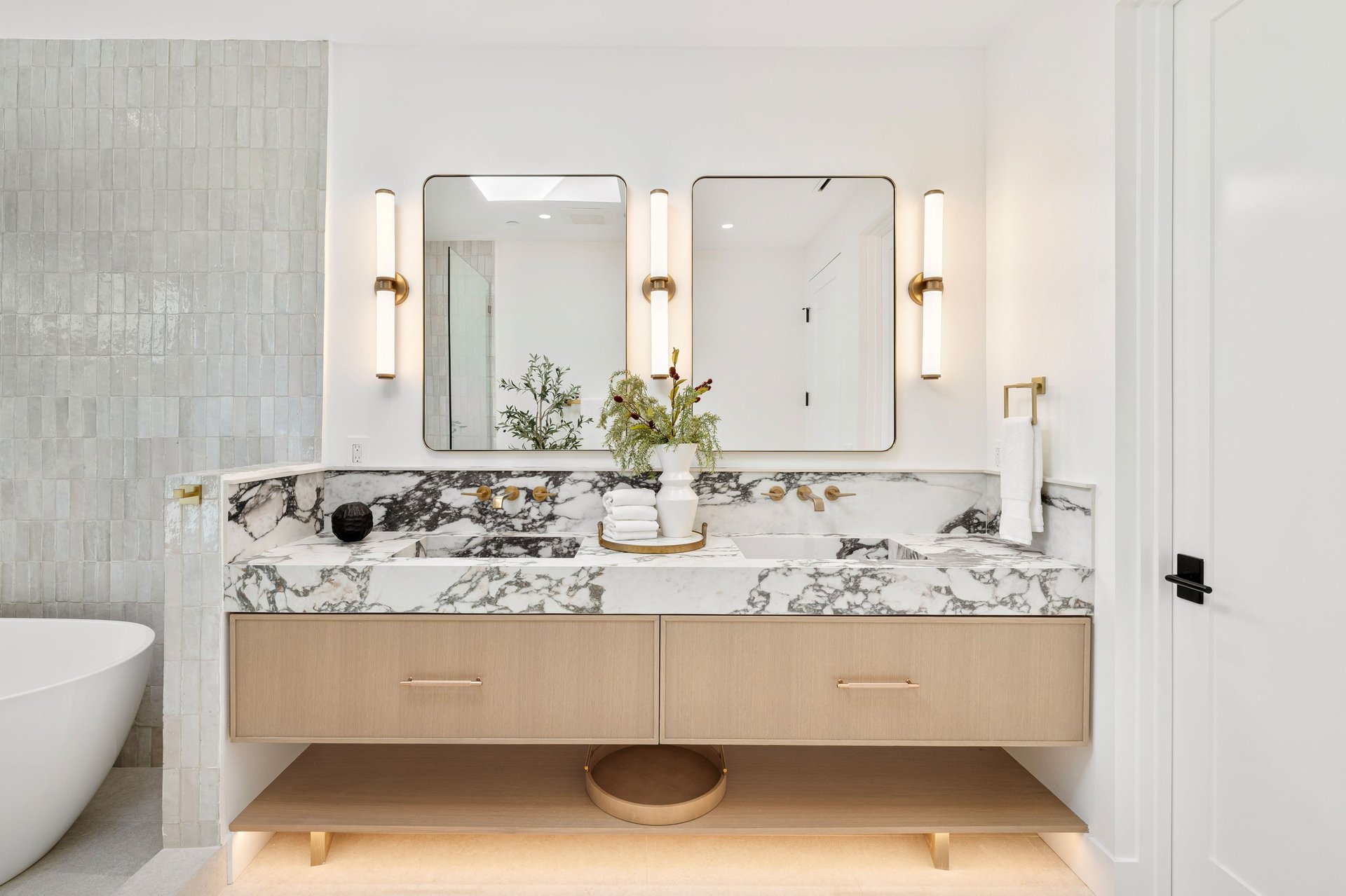 Luxury bathroom with custom vanity and marble countertop