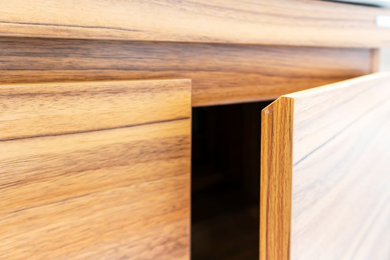 Custom cabinet design detail showing handleless wooden door
