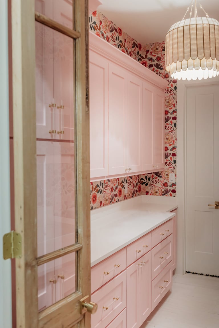 Custom pink built-in cabinetry with luxury designer finishes