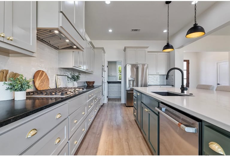 Luxury custom kitchen cabinets in Gainesville TX by Southern Shore Custom Cabinets – white and dark island cabinetry