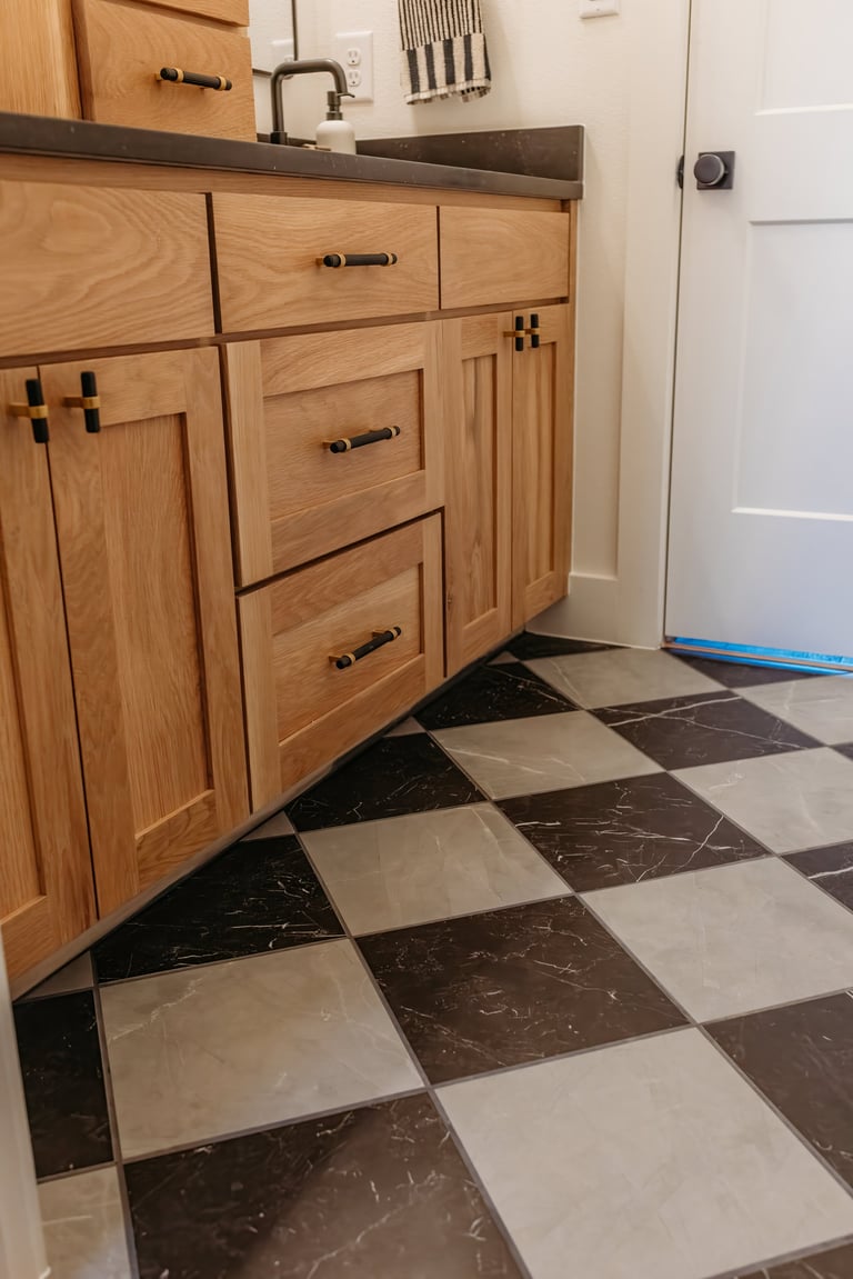 Custom bathroom vanity cabinets Denison TX – light wood with dark stone